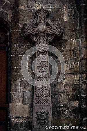 GLASGOW, SCOTLAND, DECEMBER 16, 2018: Wonderful embossed Celtic stone cross, full of details and textures in its Editorial Stock Photo