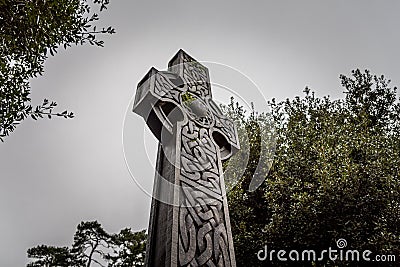 Wonderful embossed Celtic stone cross, full of details and textures in its elaborate carvings and lichen growing Stock Photo