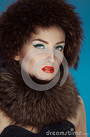 Wonderful girl in a fur hat and scurf Stock Photo