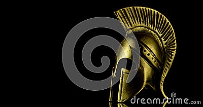A wonderful golden spartan helmet as part of the equipment of ancient Greek soldiers Stock Photo