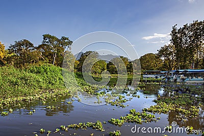 Wonderful landscape of coastline of lake Nicaragua with moored pleasure boats. Editorial Stock Photo