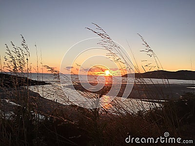 Wonderful landscape of the Spanish Shore at sunset. Hermoso atardecer en el mar. Stock Photo