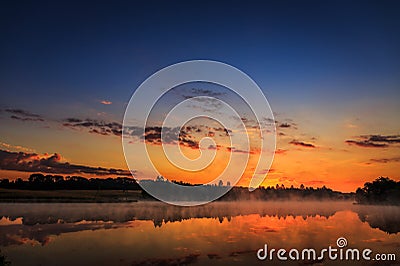 Wonderful misty morning. majestic sunrise over the lake. picture Stock Photo