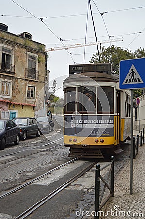 Wonderful Old Yellow Tram With A Photographer Taking Pictures Of The Monuments On Their Step Circulating Down The Streets In Editorial Stock Photo