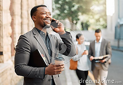 This is a wonderful opportunity. a businessman making a phone call using his smartphone. Stock Photo