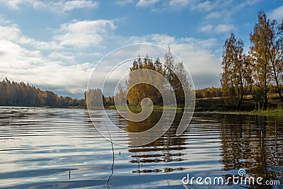 Wonderful picturesque Scene. Awesome Autumn landscape with colorful sky, reflected on the calm river. Amazing nature counryside. I Stock Photo