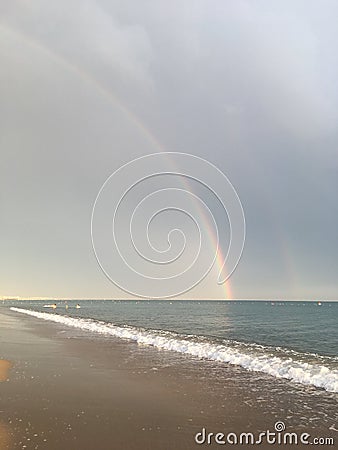 Wonderful rainbow over the sea and the beach in Turkey after heavy rain Stock Photo