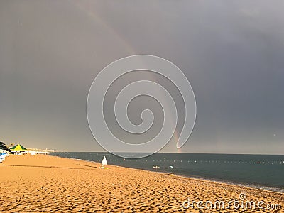 Wonderful rainbow over the sea and the beach in Turkey after heavy rain Stock Photo