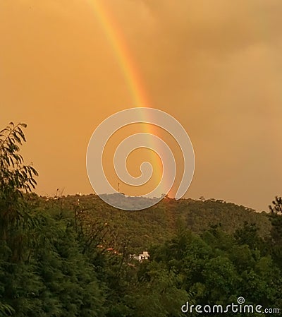 wonderful rainbow on a summer afternoon in the countryside of sÃ£o paulo Stock Photo