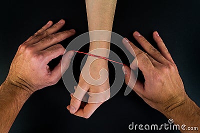 Wonderful red thread on a black background in the cart Stock Photo