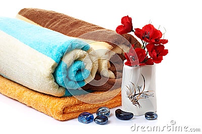 Wonderful stones ,vase with flowers and towels. Stock Photo