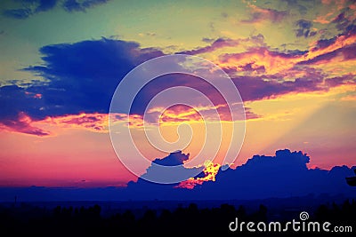 Wonderful sunset with dark blue clouds, evening Stock Photo