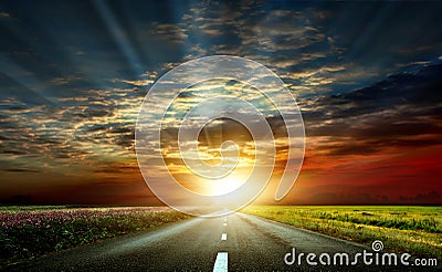 A wonderful sunset and a paved road Stock Photo