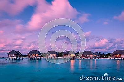 Wonderful twilight time at tropical beach resort in Maldives Stock Photo