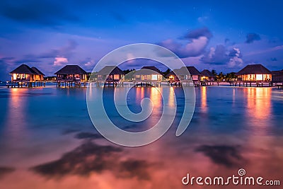 Wonderful twilight time at tropical beach resort in Maldives Stock Photo