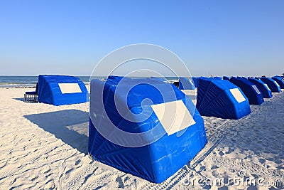Blue Beach Cabanas on a White Sand Tropical Beach Stock Photo