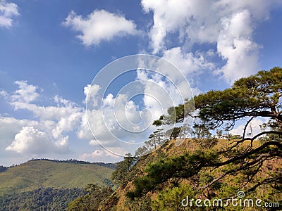 Wonderful view of big fluffy cloud over top of mo Stock Photo