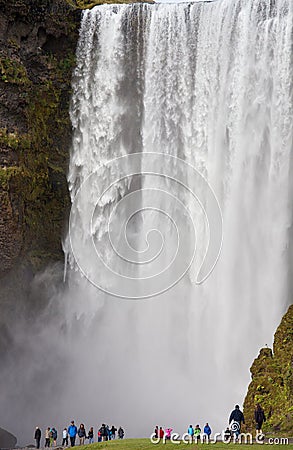 Wonderful view of Skogafoss Waterfall in Iceland. Sunlight day in summer with green landscape. Editorial Stock Photo
