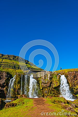 Wonderful waterfal Kirkjufellsfoss in Iceland in Autumn colors Stock Photo