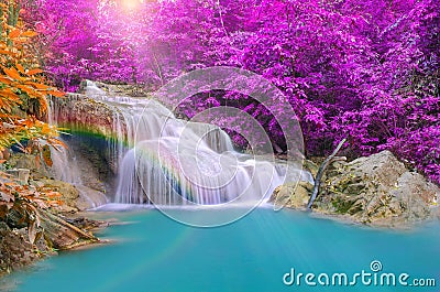 Wonderful Waterfall with rainbows in deep forest at national park Stock Photo