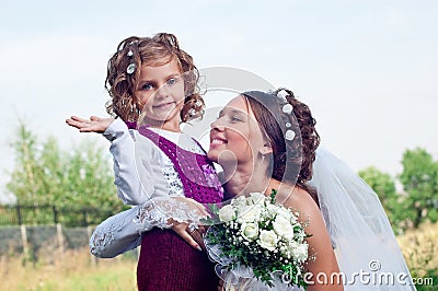 Wonderful young fiancee and beautiful little girl Stock Photo