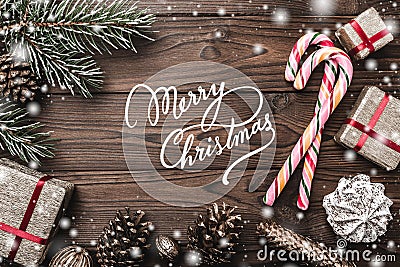 Wood background. Fir tree, decorative cone. Message space for Christmas and New Year. Sweets and gifts for holidays. Stock Photo