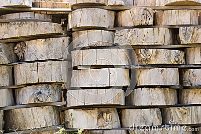 Wood background texture. Cross section of tree trunk. spili trees stumps stacked in stacks. Used for garden doropok, interior and Stock Photo