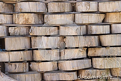 Wood background texture. Cross section of tree trunk. spili trees stumps stacked in stacks. Used for garden doropok, interior and Stock Photo