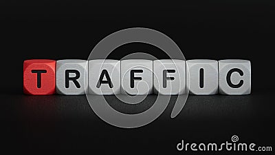 Wood block cube shape put the front computer keyboard with word TRAFFIC. Stock Photo