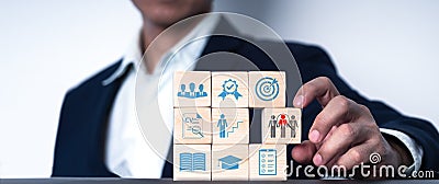 a wood blog with icon Concept of job search, headhunting, recruiting procedure. there are icons for talents, education, Stock Photo