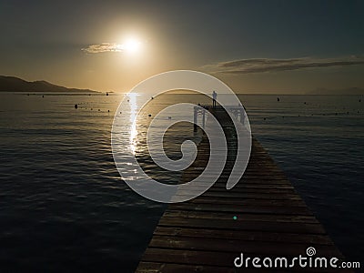 Wood boards old pier, Playa de Muro beach sunrise, Mallorca, Spain Stock Photo