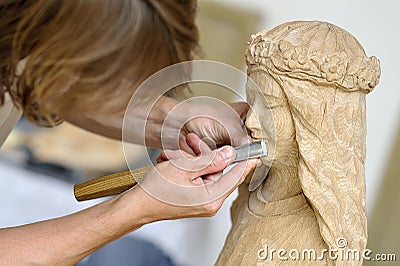 Wood carver at work Stock Photo