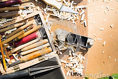 Wood carving tools. Hanmade hobby concept with cutters. Wood shavings with copy space Stock Photo