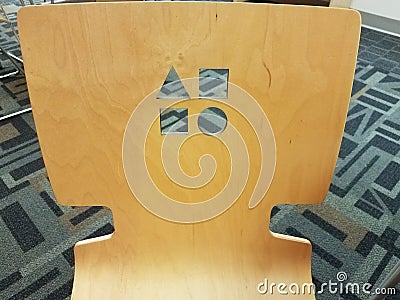 Wood chair with shapes on it Stock Photo