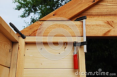 Wood Clamps on Garden Shed Stock Photo