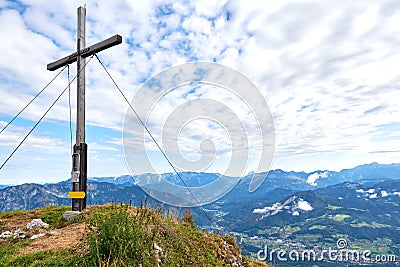 A wood cross on top of the mountain Kalmberg and rays of the sun. Beautiful landscape. Salzkammergut region Stock Photo