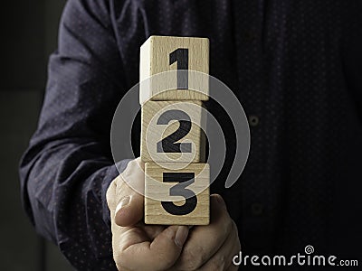 Wood cube stack 1 2 3 priority. Priorities and business important planning urgency concept. Business competition concept Stock Photo