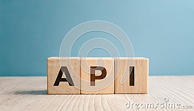 Wood cubes with abbreviation text API on wooden table. Application Programming Interface Stock Photo