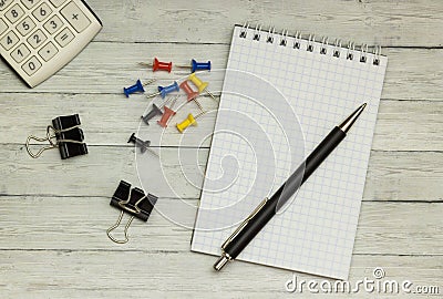 Wood desk, notepad, ballpoint pen, calculator, background Stock Photo