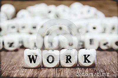 Wood dice with Words WORK Stock Photo
