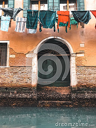 Wood door and window. On redbrick wall, building facade in Venice, exterior design Stock Photo