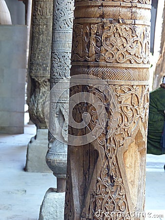 Wood engraved ancient columns inside the mosque Juma of Khiva in Uzbekistan. Editorial Stock Photo