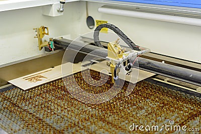 Wood engraving laser burning machine, industrial laser cutter Stock Photo