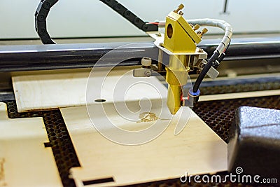 Wood engraving laser burning machine, industrial laser cutter Stock Photo