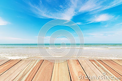 Wood floor on beach and blue sky background Stock Photo