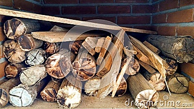 Wood logs inside stove Stock Photo