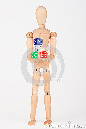 Wood mannequin holding colorful block dice Stock Photo