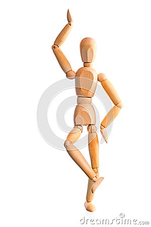 Wood mannequin holds balance on one leg Stock Photo