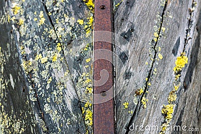 Wood and metal hull of a rotten and stranded boat wreck on land. Stock Photo