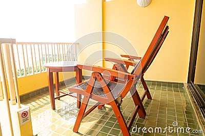 wood patio chair on balcony Stock Photo